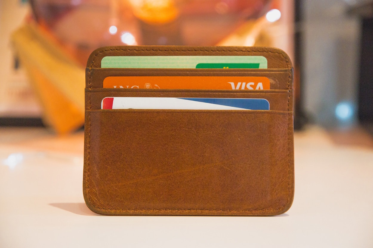 brown wallet with credit cards