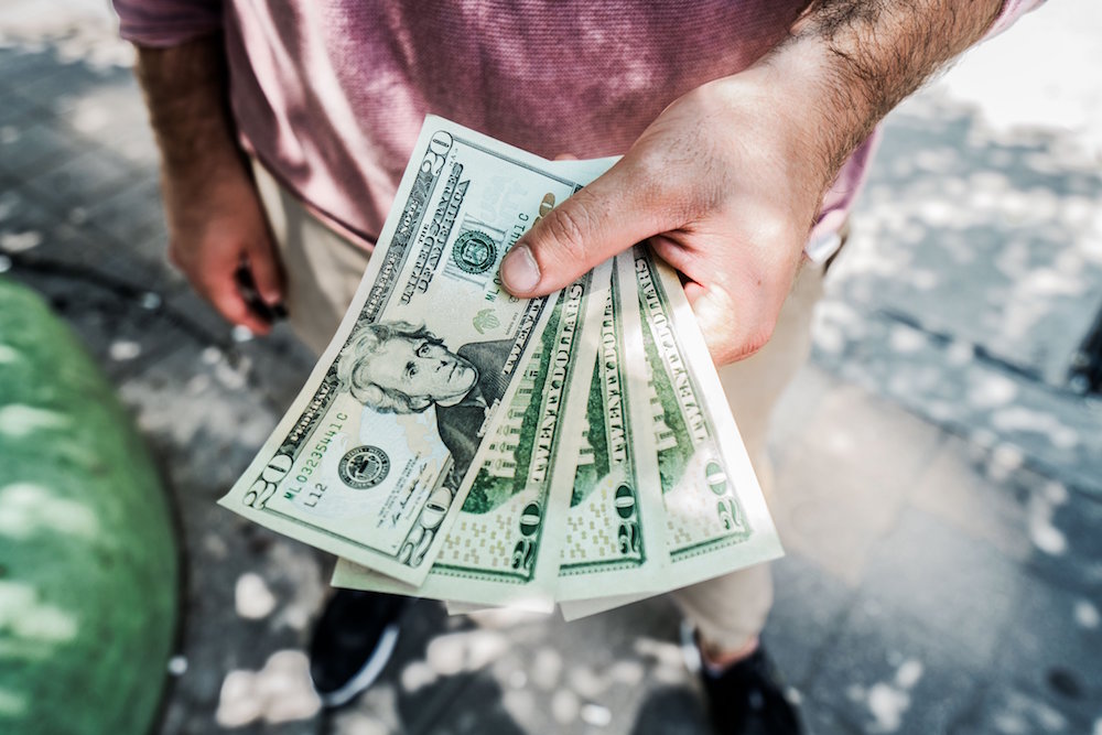 man with cash in hand