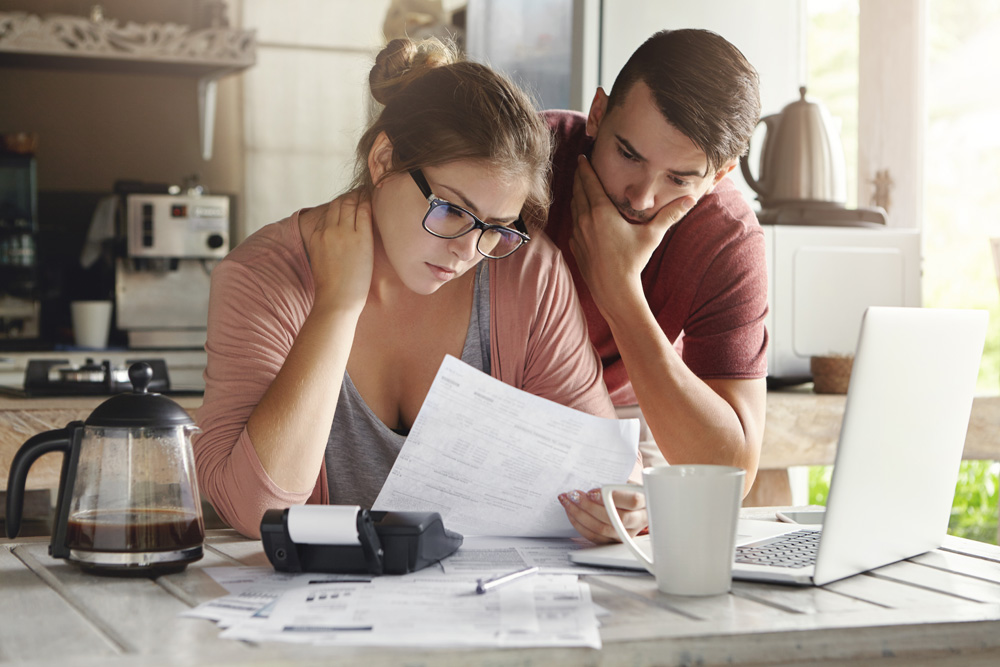 couple reviewing bill debt