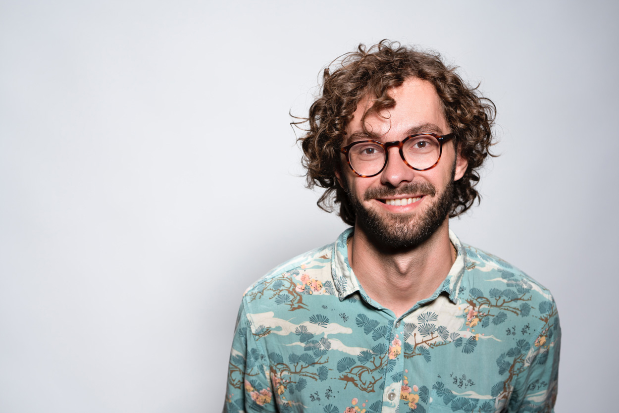 man wearing glasses and collared shirt