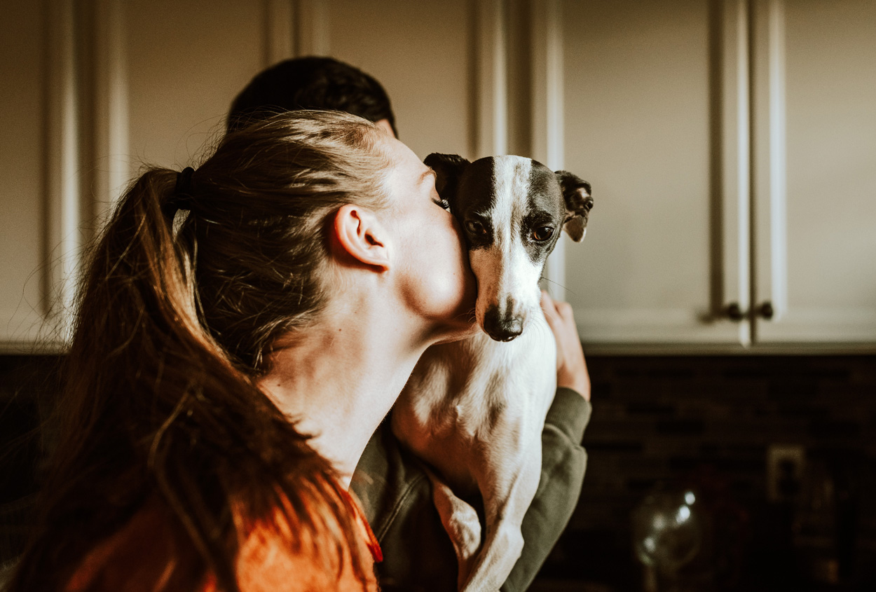 woman hugging a dog